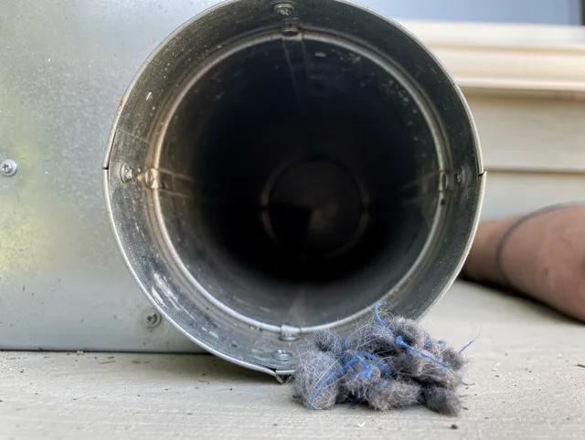 Avon Lake Dryer Vent Cleaning technician using specialized equipment to clear severe dryer vent blockage in Avon Lake